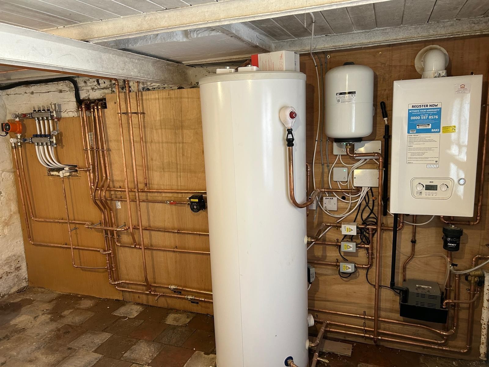 Central heating installation with system boiler, unvented cylinder and copper pipework in Manchester