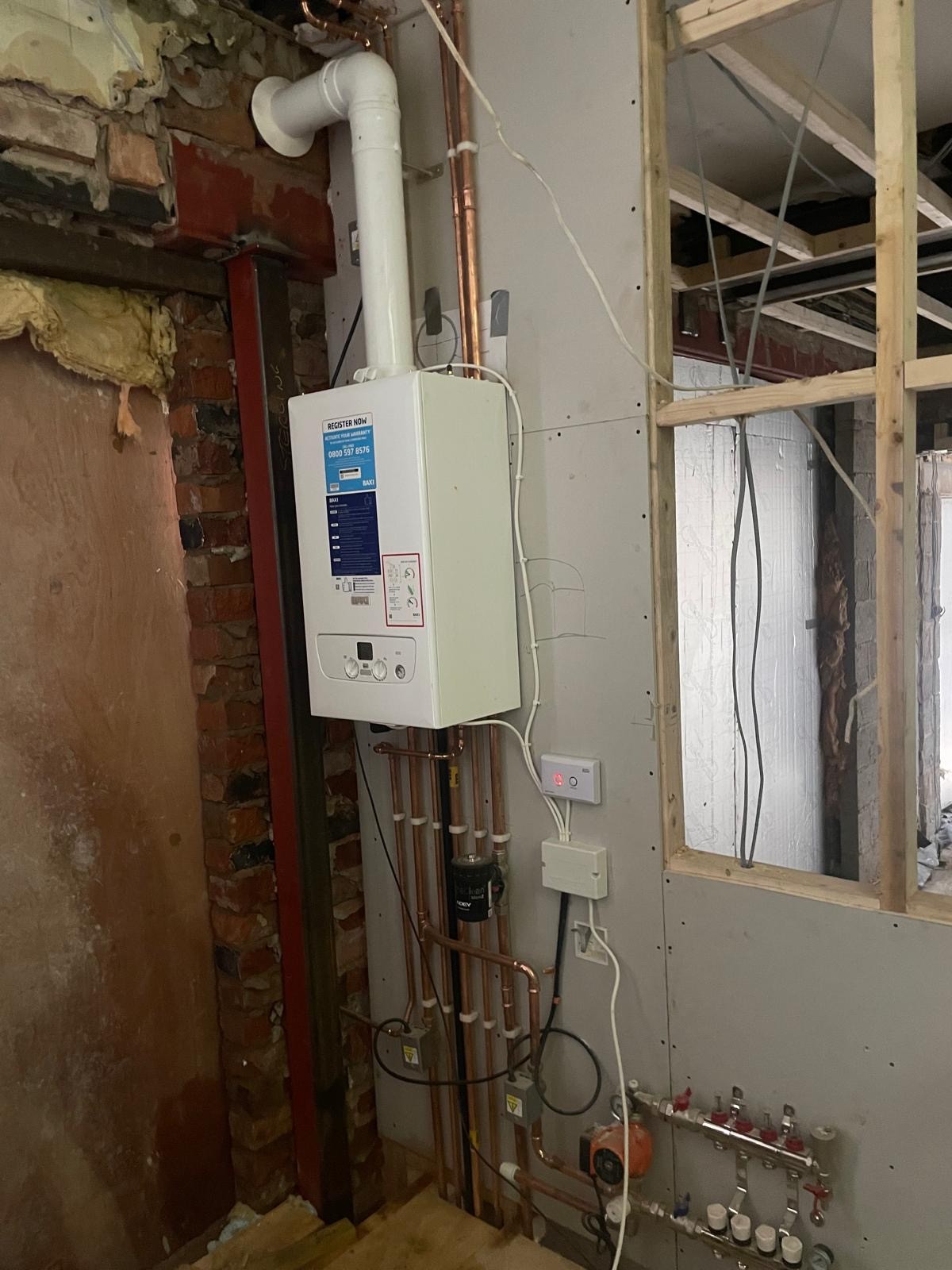 New Baxi combi boiler installation with tidy copper pipework in a Manchester home