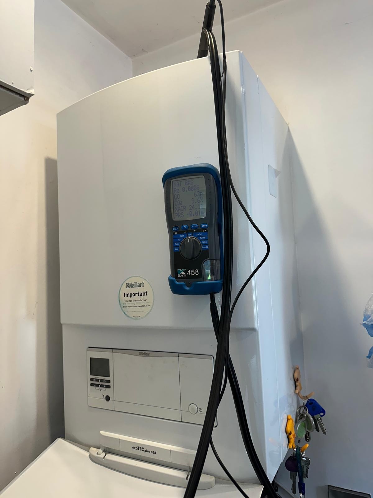 Flue gas analyser recording combustion readings during a boiler service in Manchester