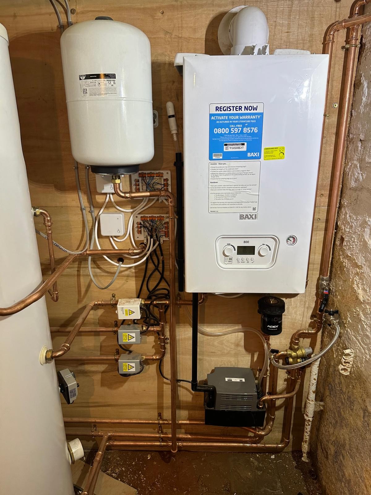 Baxi system boiler with zone valves, magnetic filter and cylinder on a Manchester central heating installation