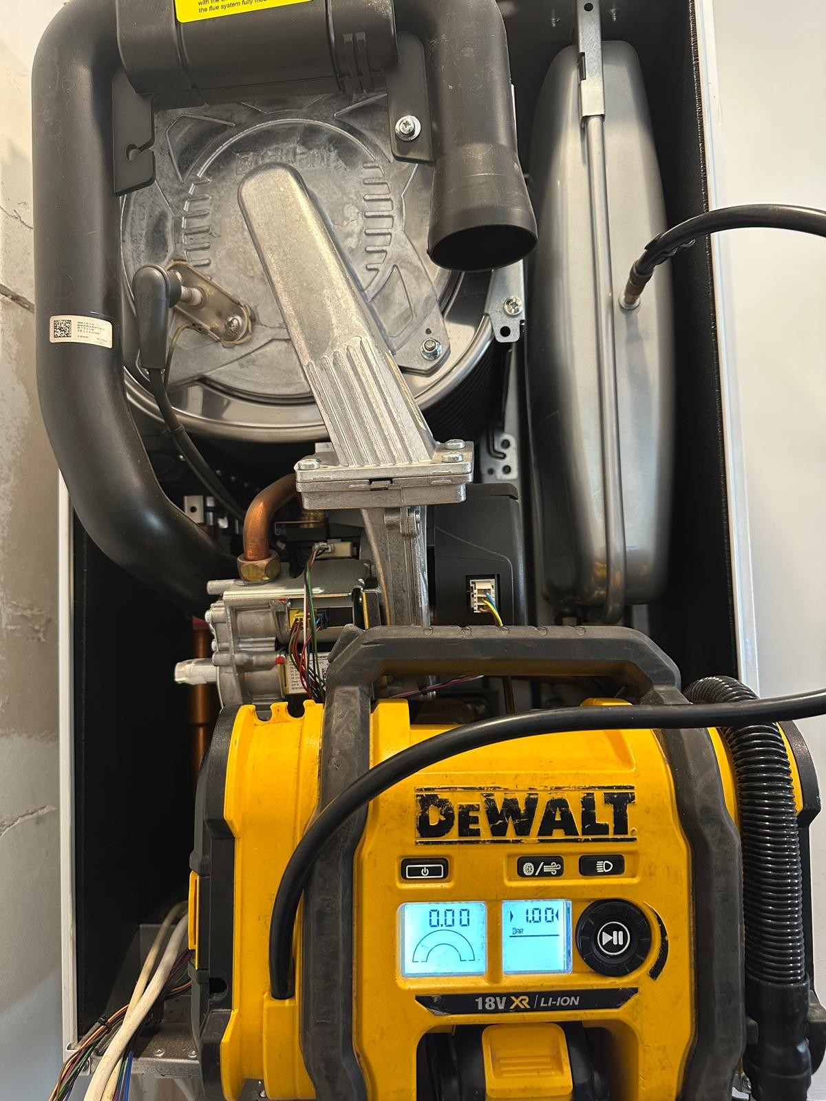 Boiler casing removed to check expansion vessel pressure during a boiler repair in Manchester