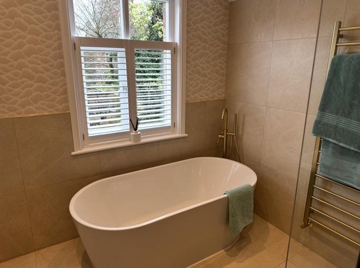 Freestanding bath plumbed in during a bathroom installation in Trafford